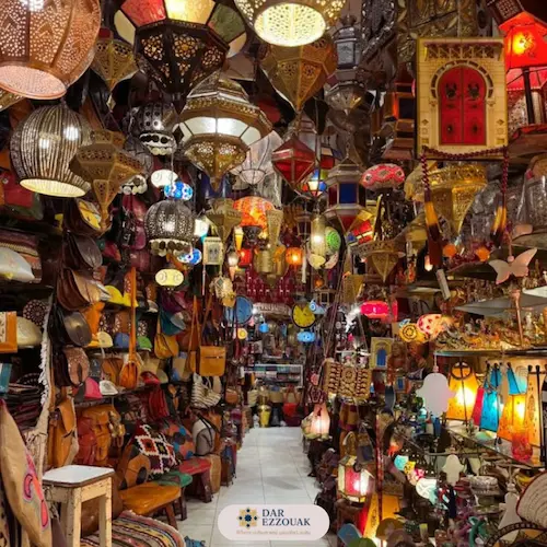 Colorful Marrakech souk with textiles, lamps and spices