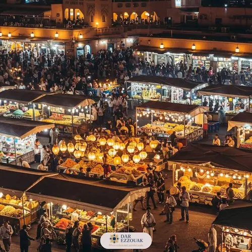 Jemaa el‑Fnaa square at night with food stalls and lights in Marrakech