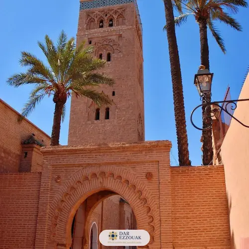 Koutoubia Mosque minaret framed by palm trees and gardens