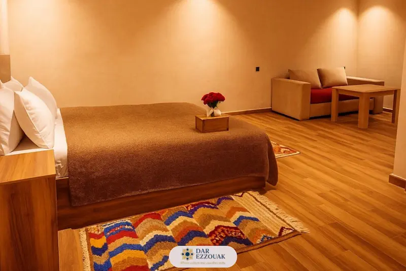 Rooms in Marrakech guest house – Nejma Suite at Dar Ezzouak with living area and terrace